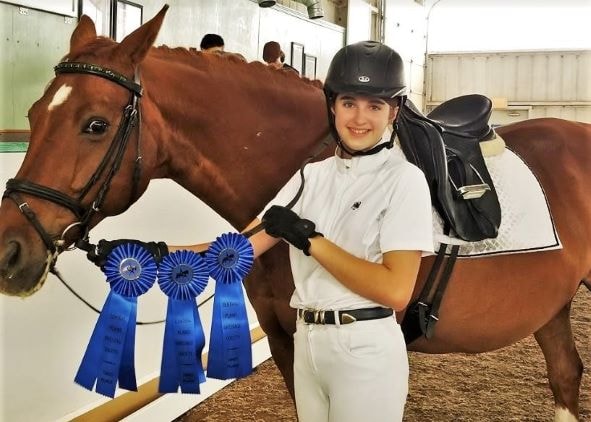 Chloe with Bronze Medal Ribbons