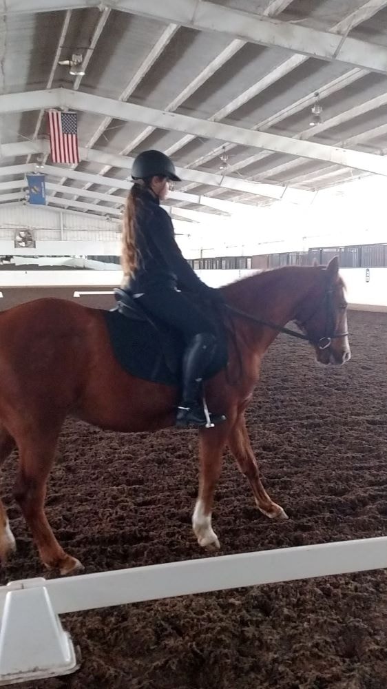 Chloe riding Nic